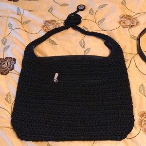 The Sak tote black in color crocheted straps